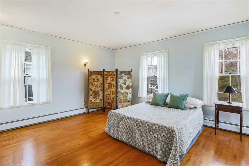 61 William Street Worcester, MA 01609 - Photo 21 of 42 a bedroom with a large bed and a table