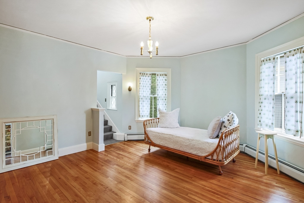 61 William Street Worcester, MA 01609 - Photo 26 of 42 a living room with furniture and a chandelier