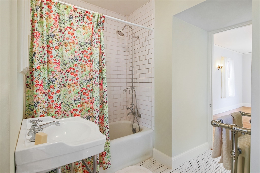 61 William Street Worcester, MA 01609 - Photo 29 of 42 a bathroom with a sink a toilet and shower