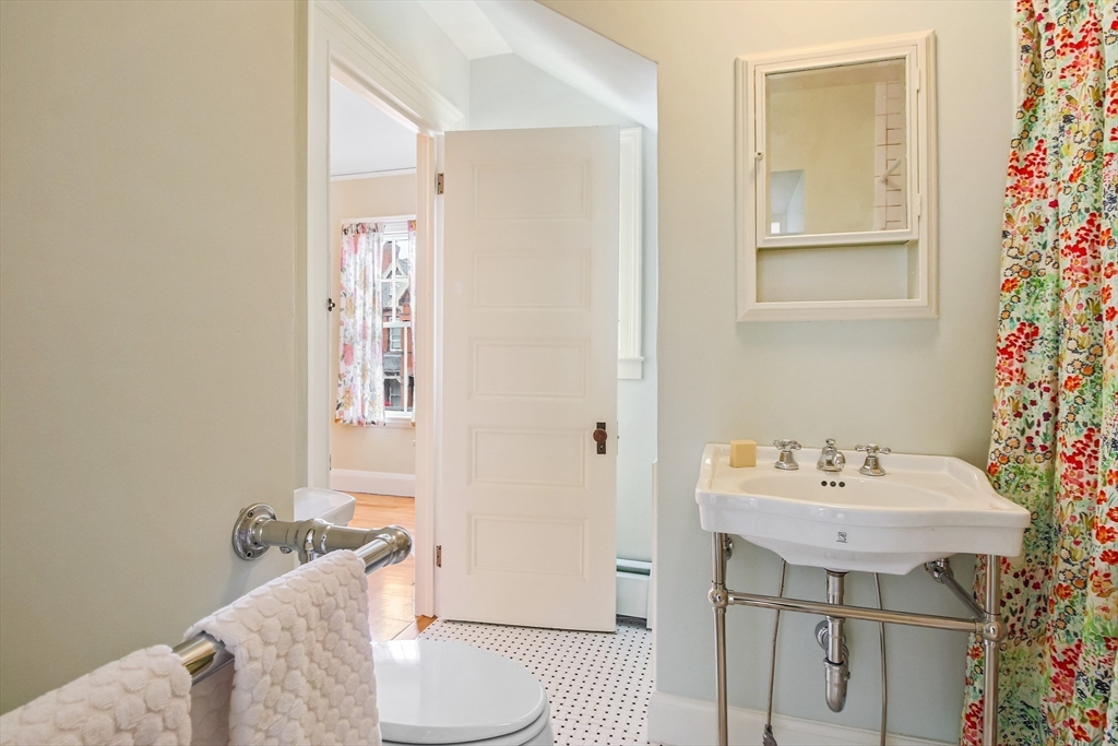 61 William Street Worcester, MA 01609 - Photo 30 of 42 a bathroom with a sink toilet and shower