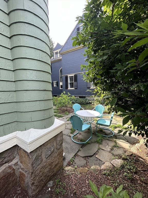 61 William Street Worcester, MA 01609 - Photo 35 of 42 a view of backyard of house with yard outdoor seating and barbeque oven