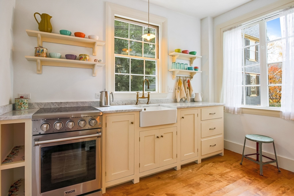 61 William Street Worcester, MA 01609 - Photo 4 of 42 a kitchen with cabinets appliances and a window