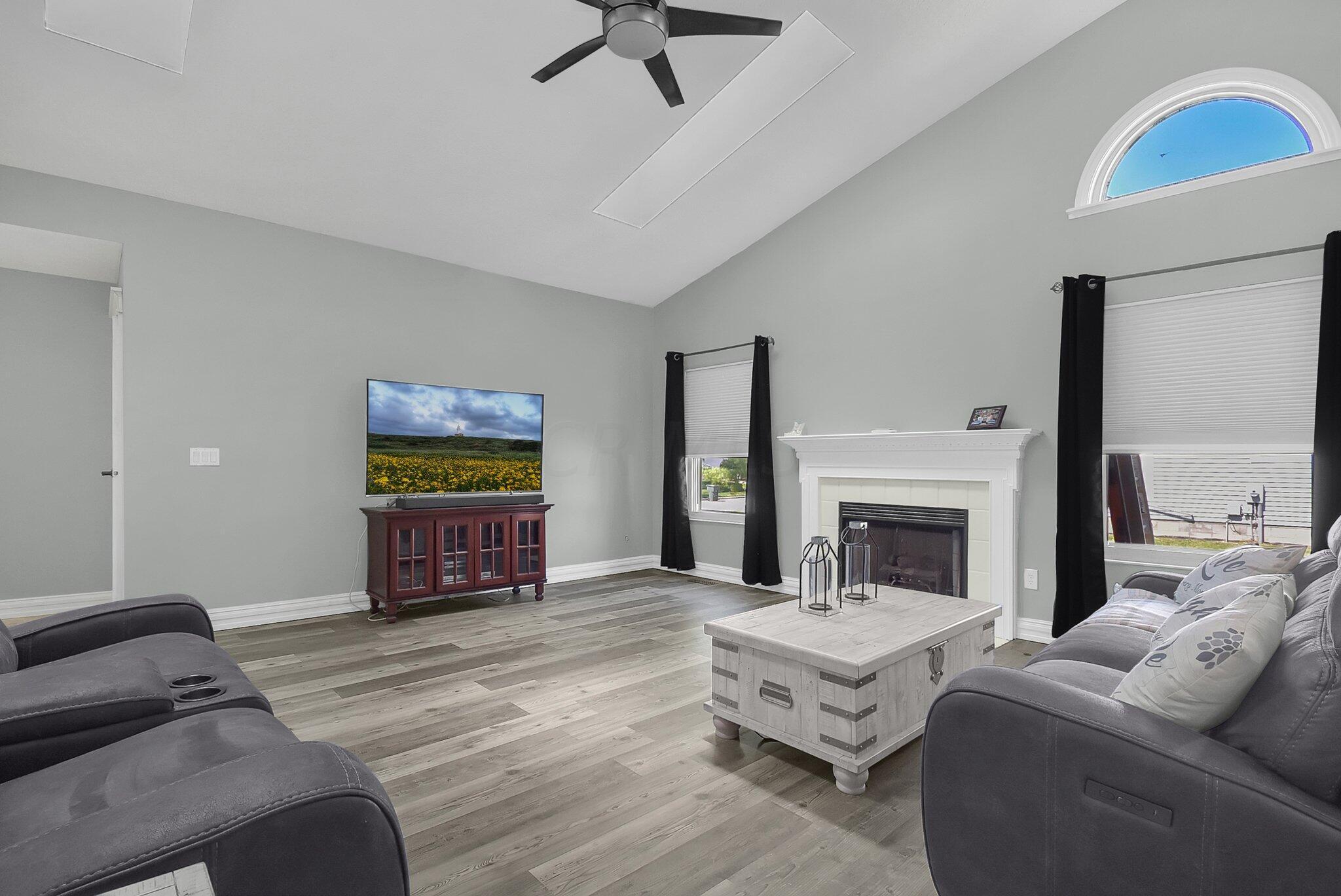 1112 Rousseau Lane Galloway, OH 43119 - Photo 10 of 43 Pergo Flooring / Fireplace / Large Windows including a transom