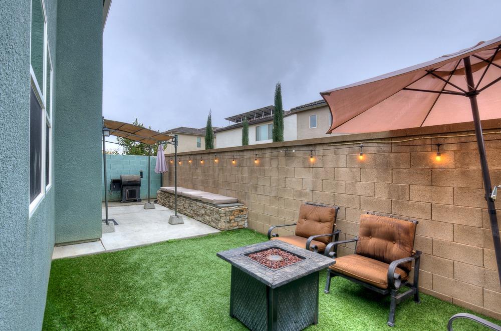 3518 Significant Way Clovis, CA 93619 - Photo 27 of 34 a backyard of a house with table and chairs