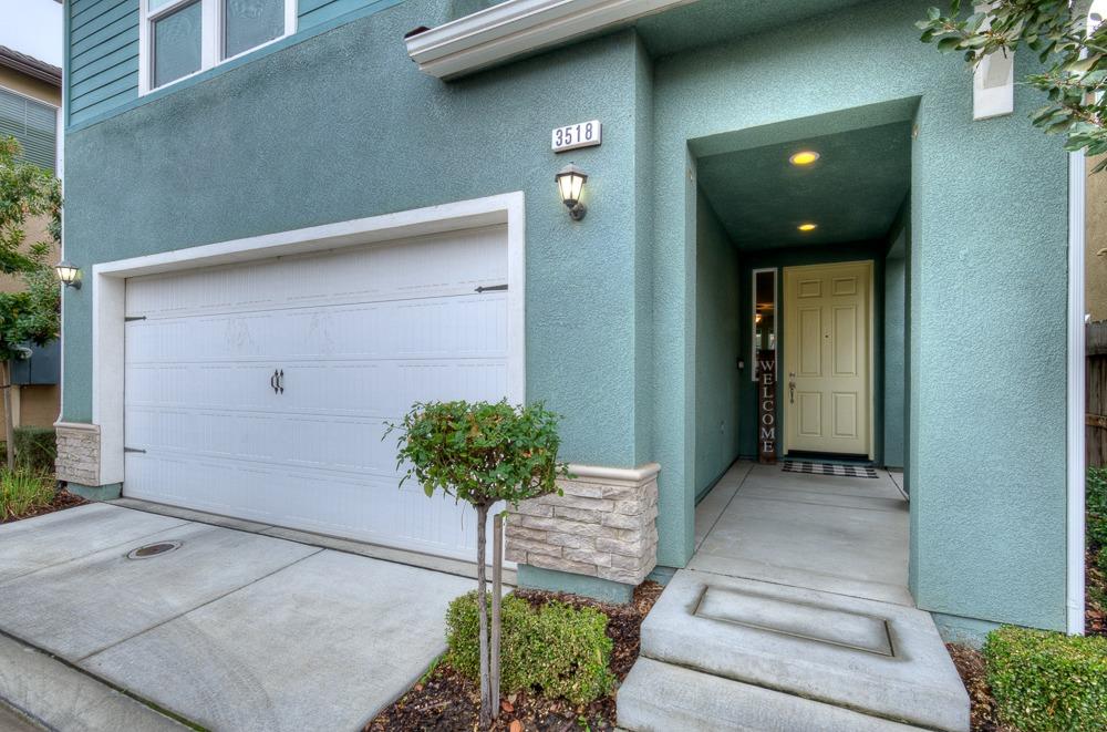 3518 Significant Way Clovis, CA 93619 - Photo 3 of 34 a potted plant sitting in front of a door