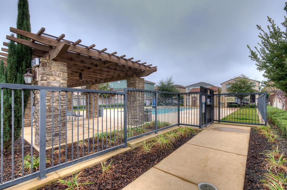 3518 Significant Way Clovis, CA 93619 - Photo 31 of 34 a view of a house with a small yard and wooden fence