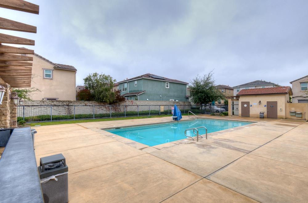3518 Significant Way Clovis, CA 93619 - Photo 32 of 34 a house with yard and a large tree