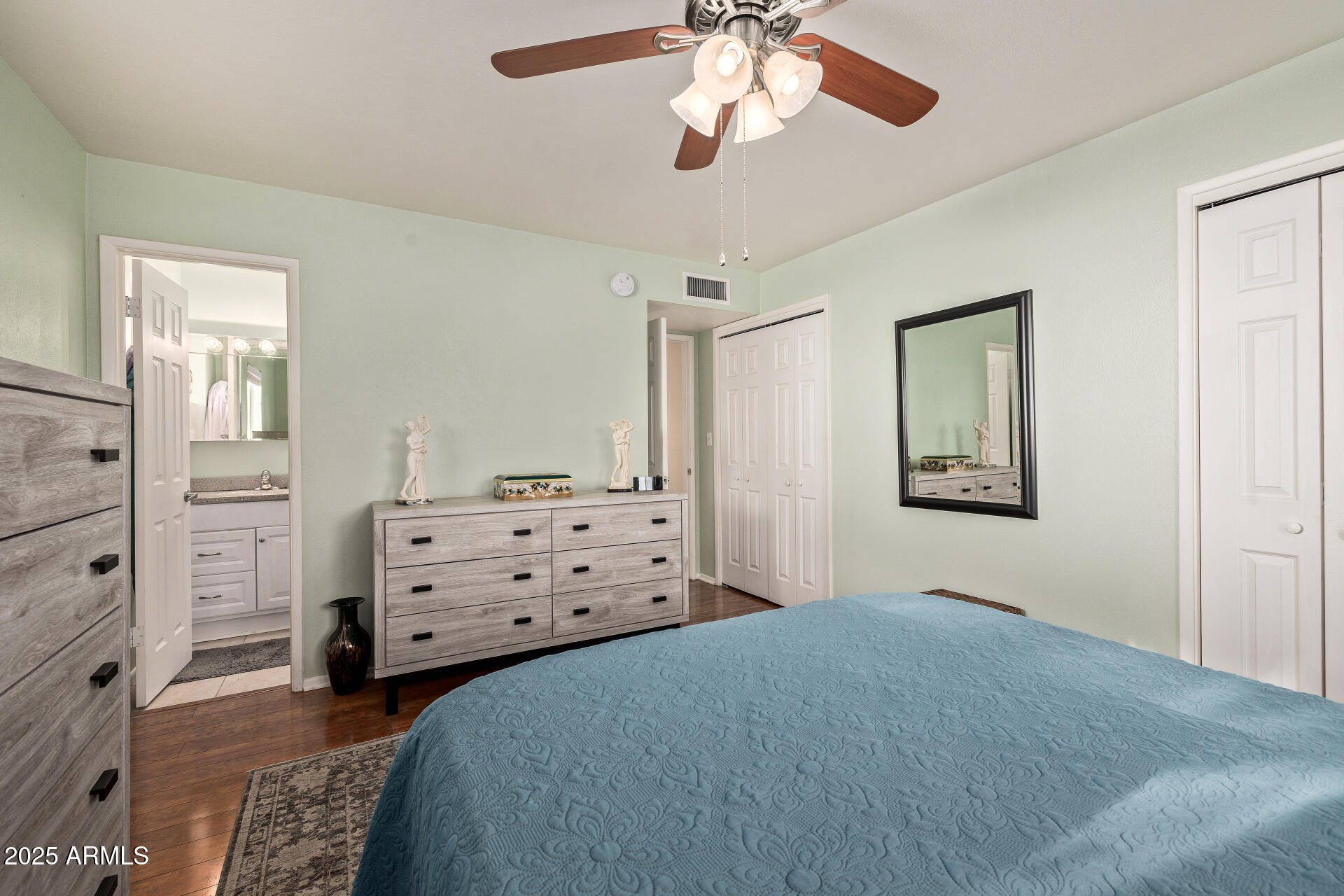 5501 East Adobe Road Mesa, AZ 85205 - Photo 13 of 38 a bedroom with a bed and a chandelier