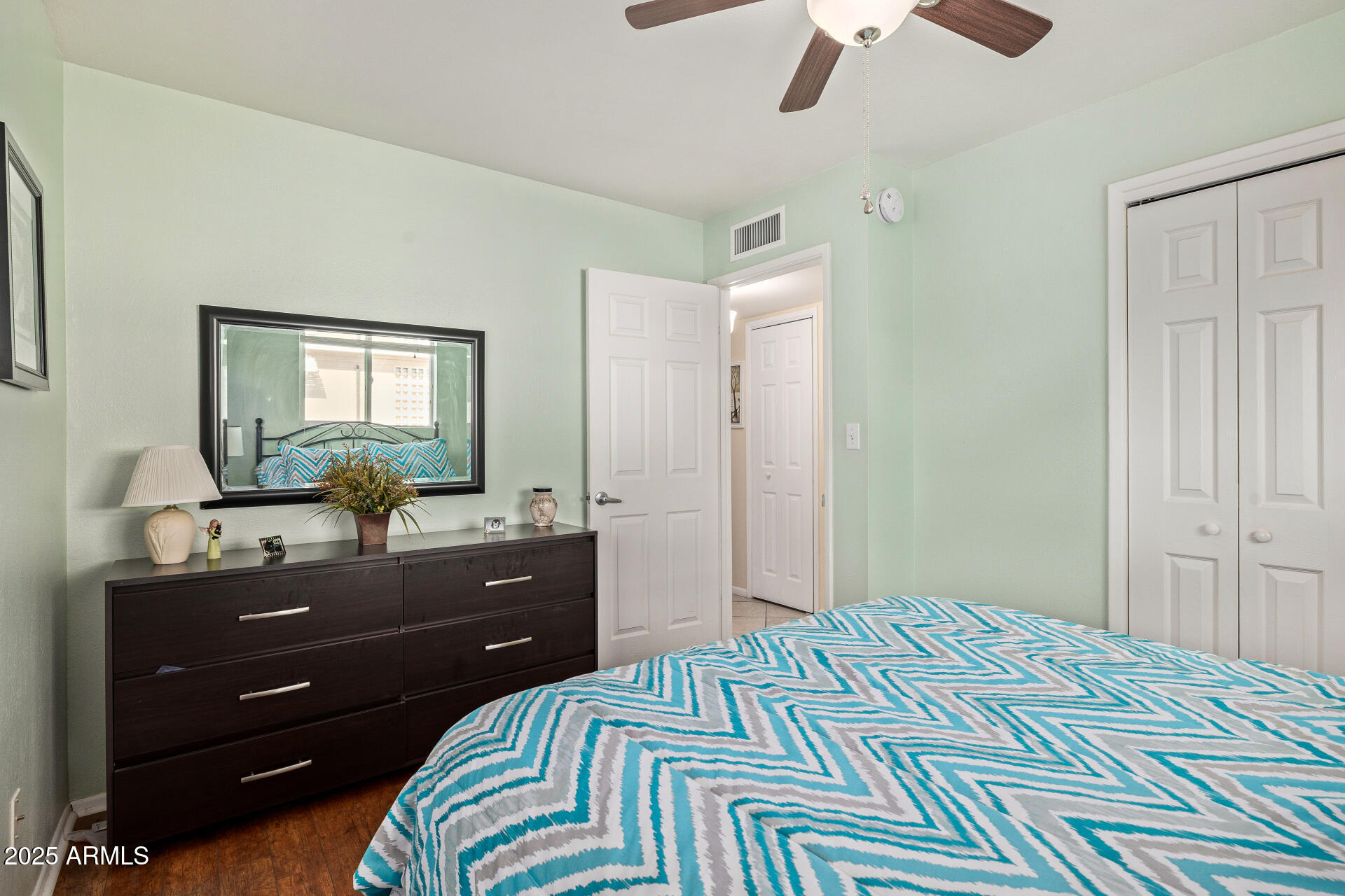 5501 East Adobe Road Mesa, AZ 85205 - Photo 16 of 38 a bedroom with a bed and a mirror on dresser