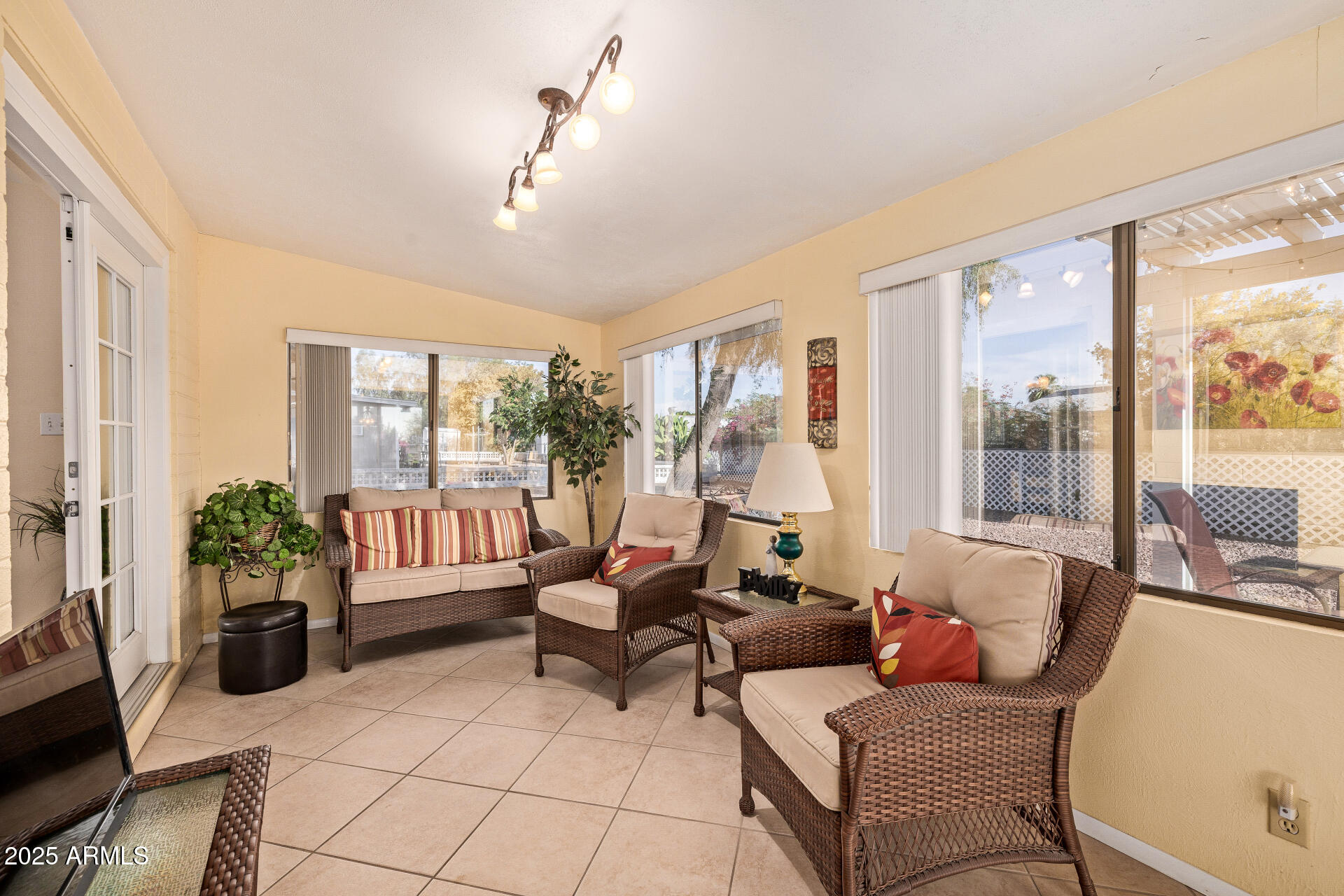 5501 East Adobe Road Mesa, AZ 85205 - Photo 18 of 38 a living room with furniture and a floor to ceiling window