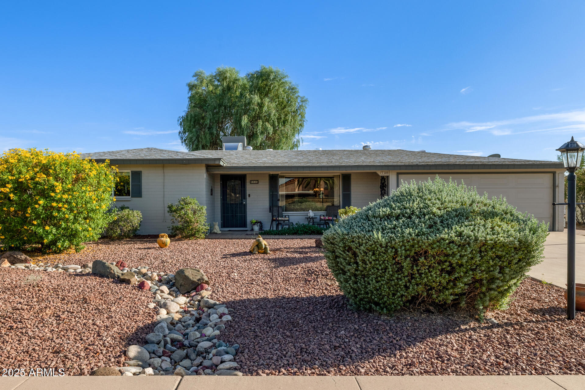 5501 East Adobe Road Mesa, AZ 85205 - Photo 27 of 38 a view of a house with a garden
