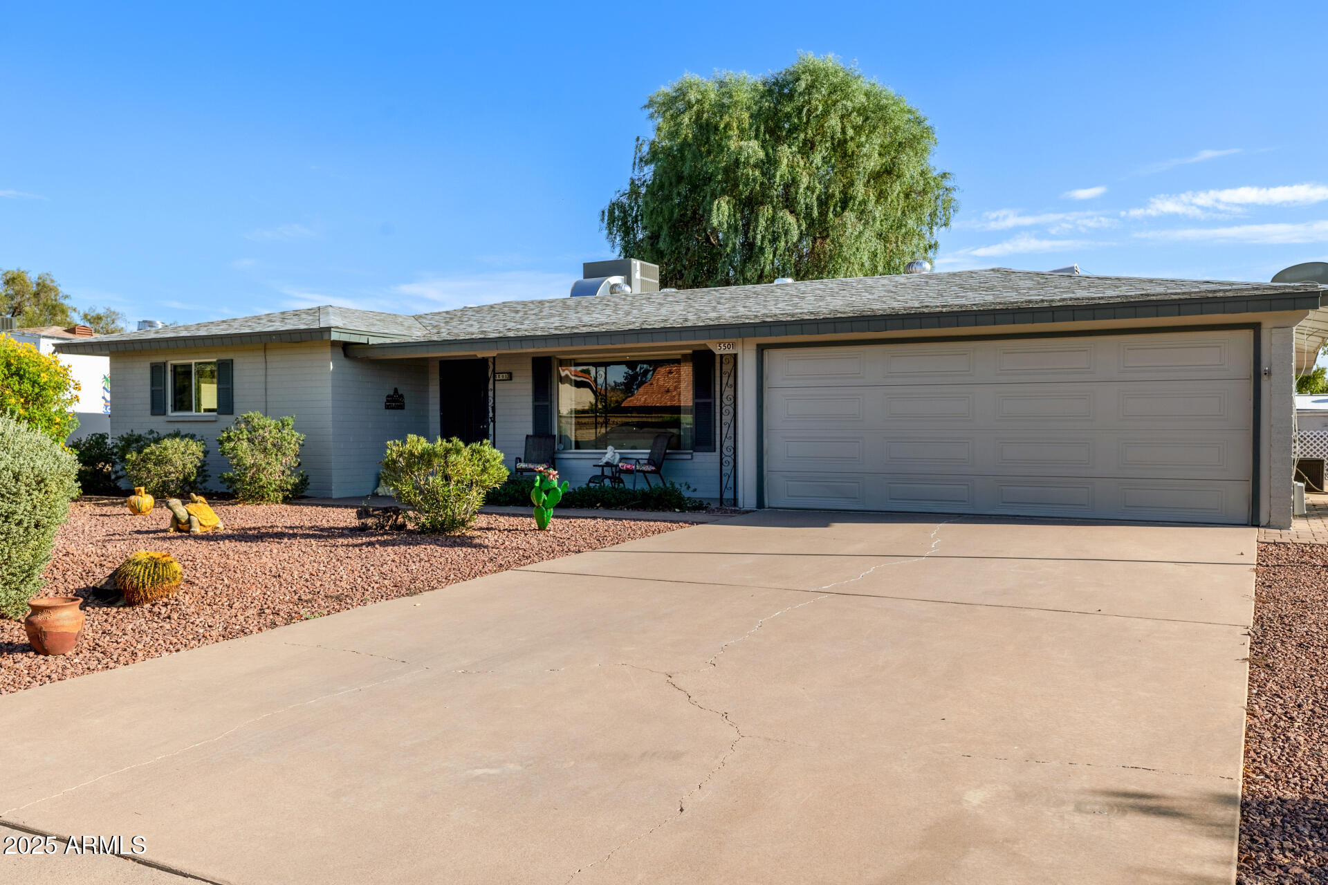 5501 East Adobe Road Mesa, AZ 85205 - Photo 29 of 38 a front view of a house with garden