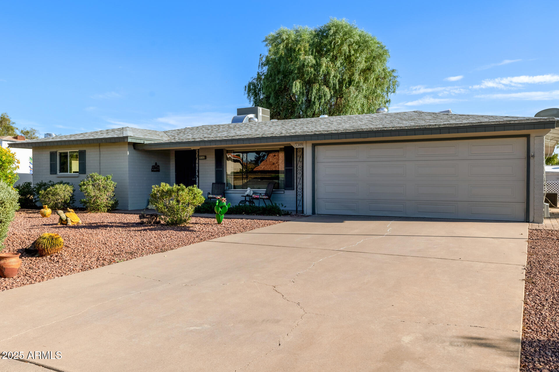 5501 East Adobe Road Mesa, AZ 85205 - Photo 3 of 38 a front view of a house with yard and a garage
