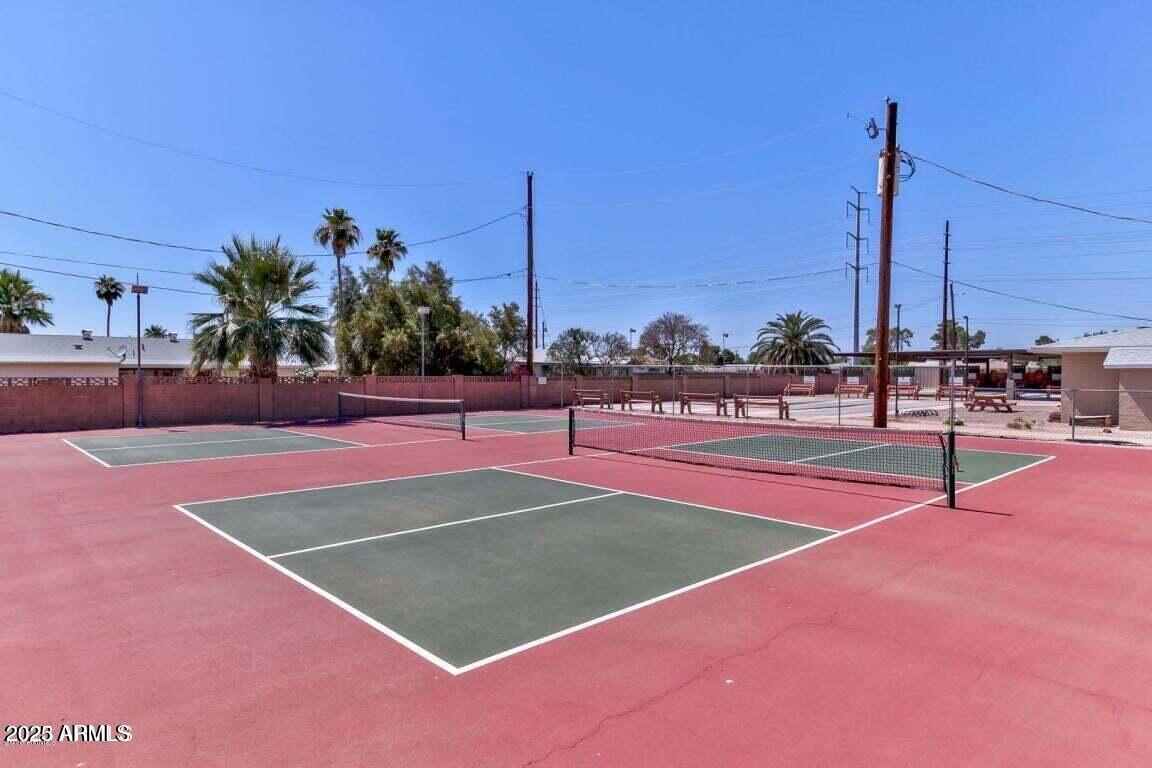 5501 East Adobe Road Mesa, AZ 85205 - Photo 34 of 38 a basketball court with view of tall buildings