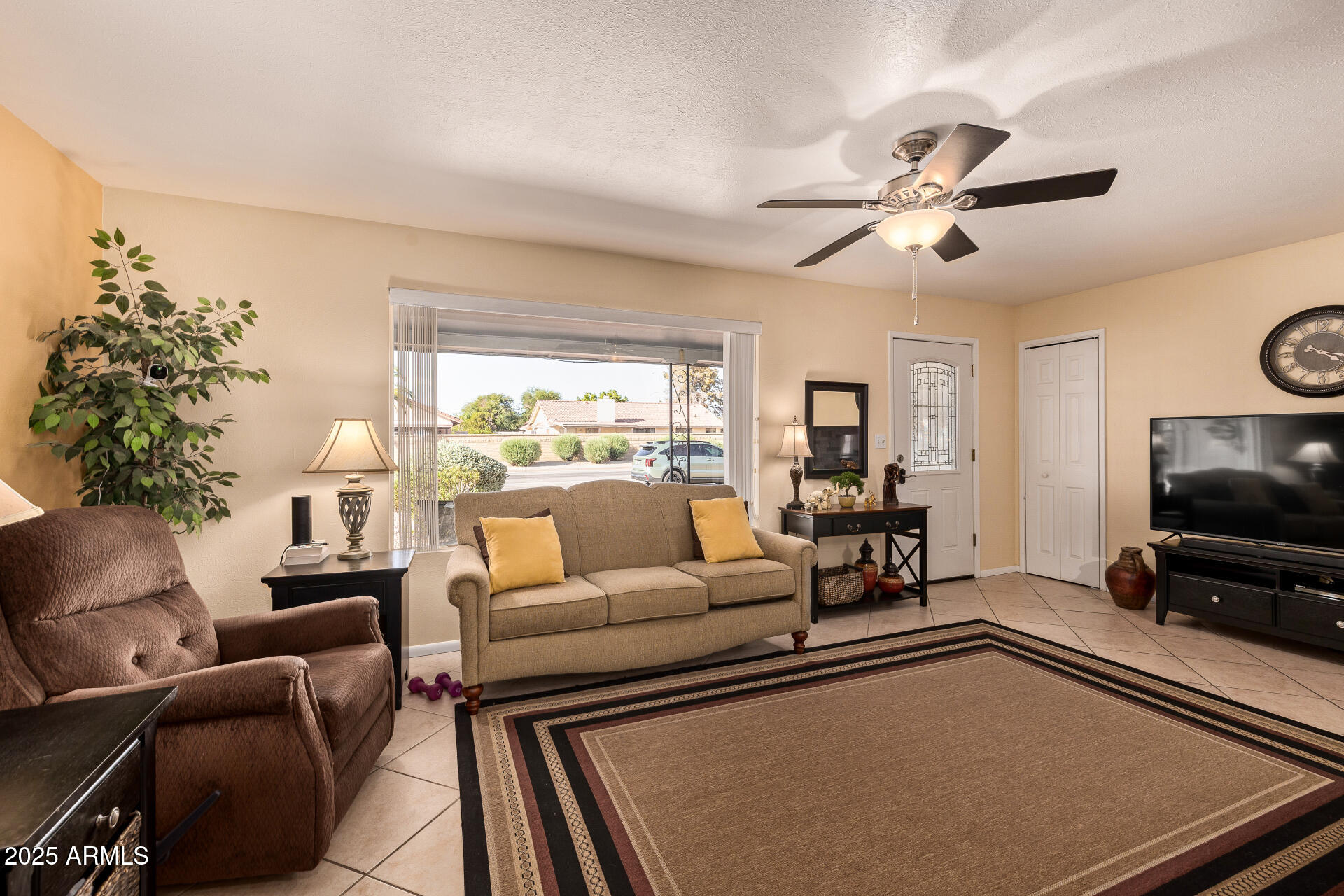 5501 East Adobe Road Mesa, AZ 85205 - Photo 4 of 38 a living room with furniture and a flat screen tv