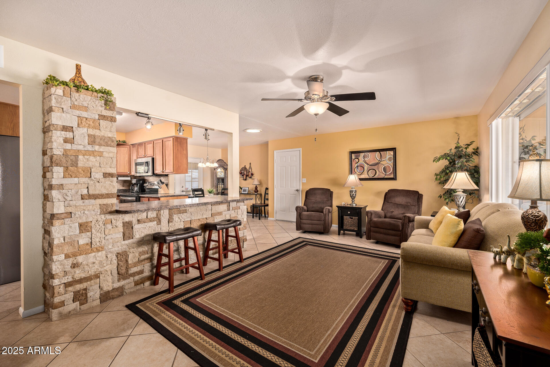 5501 East Adobe Road Mesa, AZ 85205 - Photo 6 of 38 a living room with fireplace furniture and a chandelier