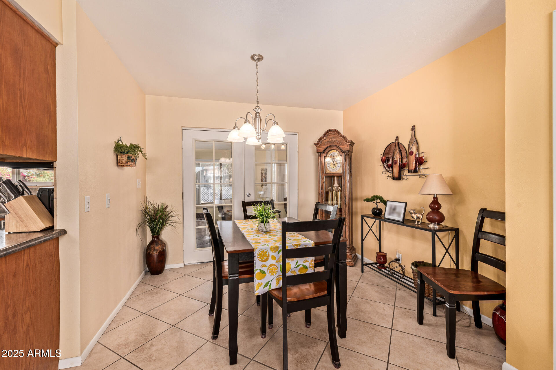 5501 East Adobe Road Mesa, AZ 85205 - Photo 7 of 38 a view of a dining room with furniture and chandelier