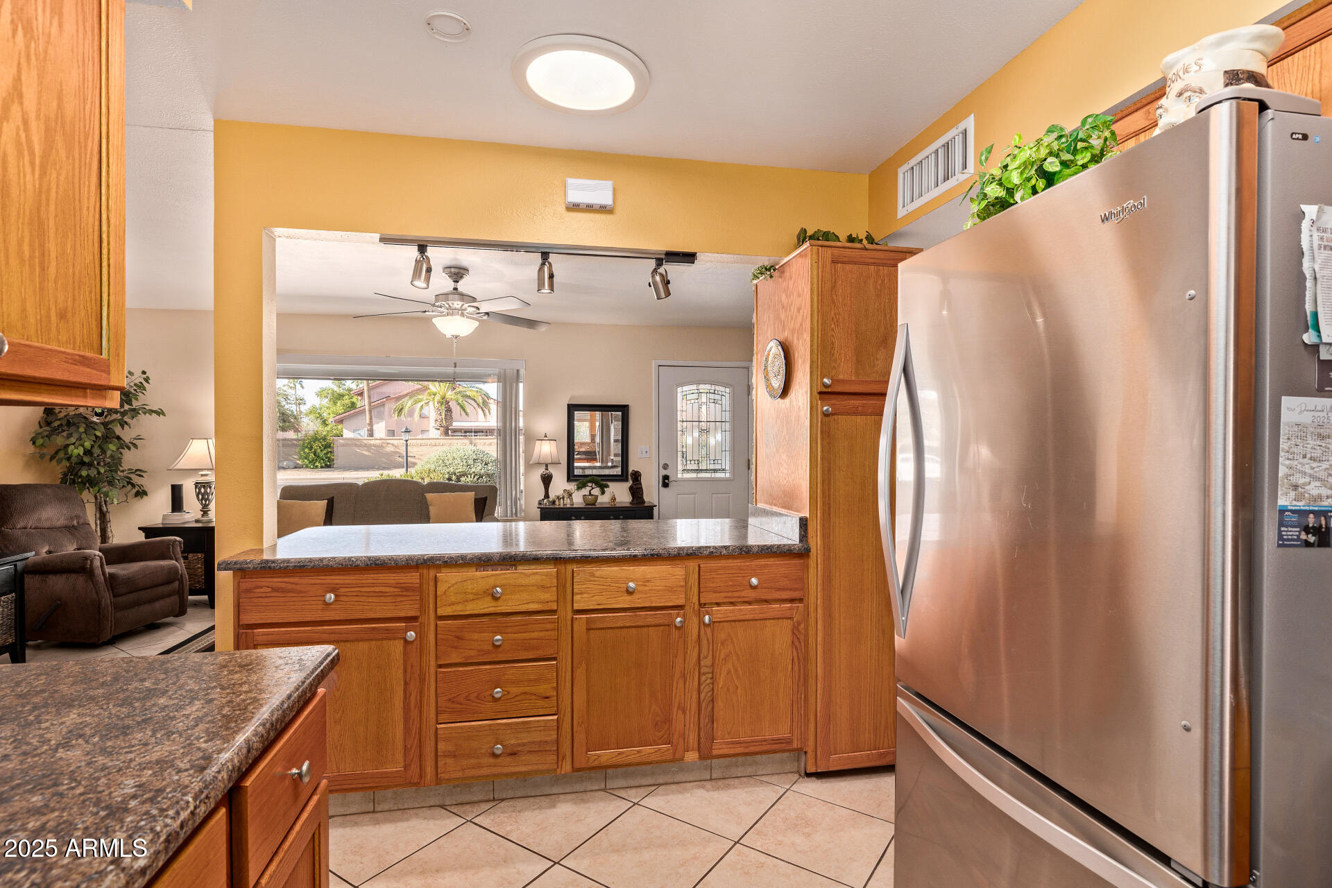 5501 East Adobe Road Mesa, AZ 85205 - Photo 10 of 38 a kitchen with stainless steel appliances a refrigerator and a stove