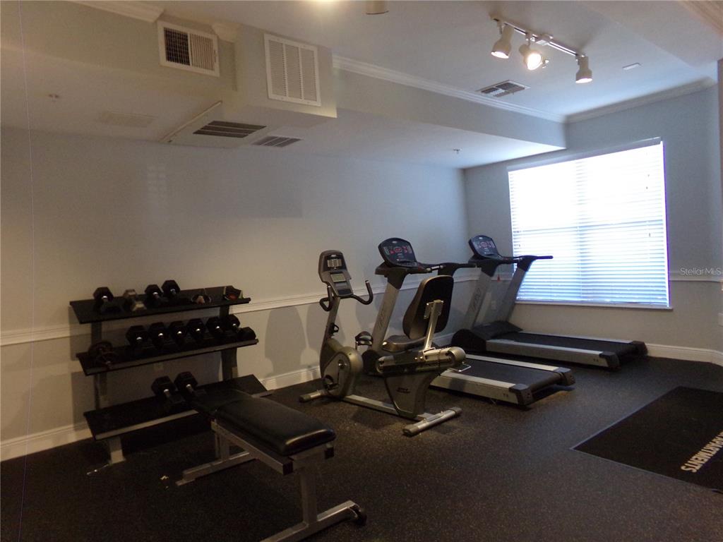 154 Tuskawilla Road, Unit 224 Winter Springs, FL 32708 - Photo 11 of 35 a view of a room with gym equipment