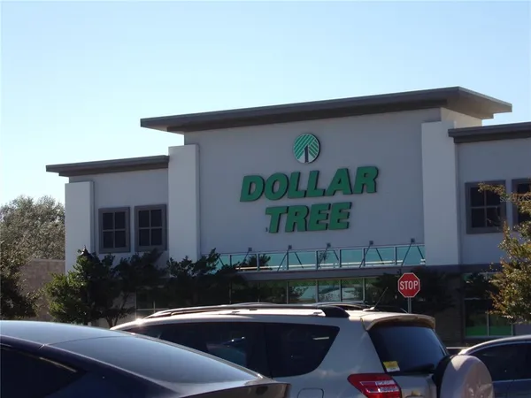 a view of a house with backyard sitting area and furniture