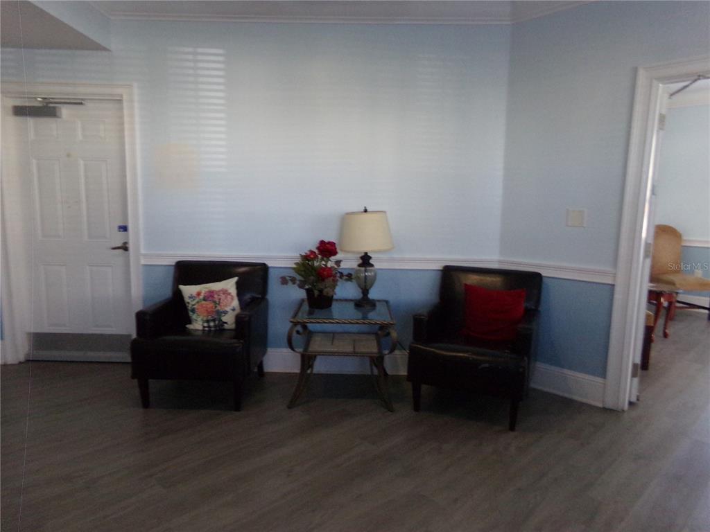 154 Tuskawilla Road, Unit 224 Winter Springs, FL 32708 - Photo 10 of 35 a living room with furniture and a flat screen tv