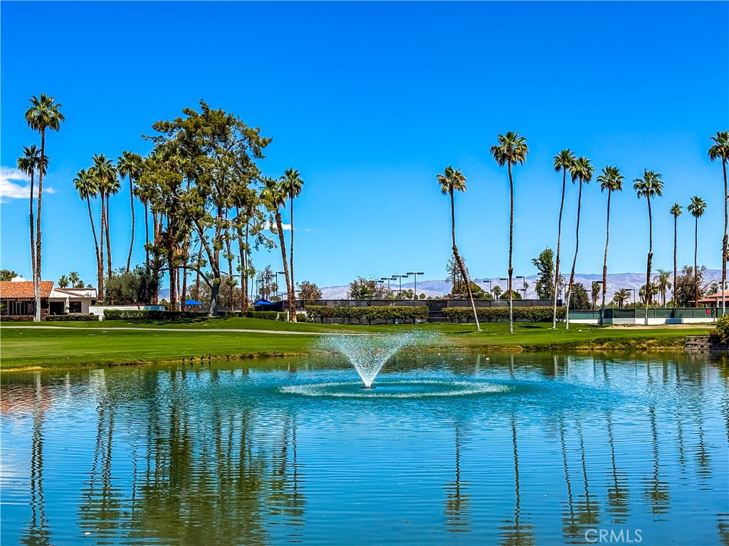74 Avenida Las Palmas Rancho Mirage, CA 92270 - Photo 1 of 23 a view of a lake with a large trees
