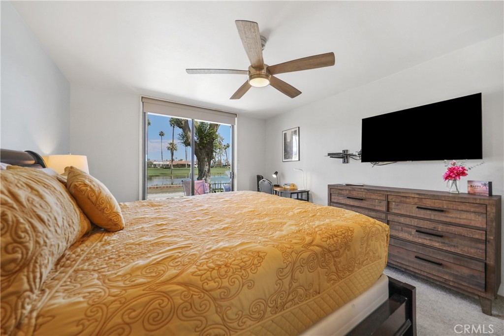 74 Avenida Las Palmas Rancho Mirage, CA 92270 - Photo 11 of 23 a bedroom with a bed and a flat screen tv
