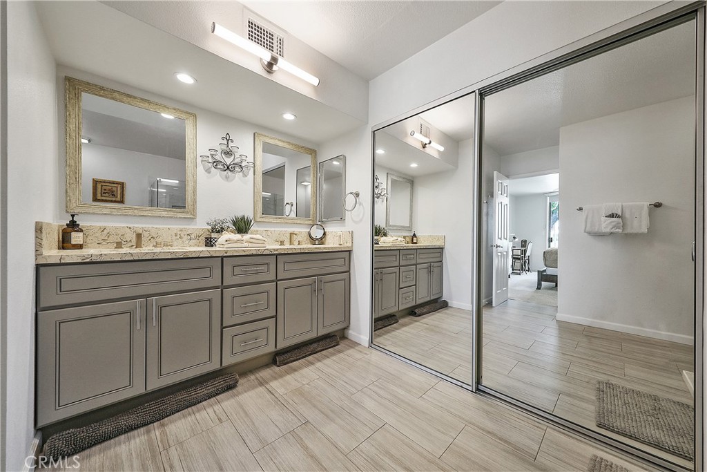74 Avenida Las Palmas Rancho Mirage, CA 92270 - Photo 14 of 23 a bathroom with a sink a mirror and a shower