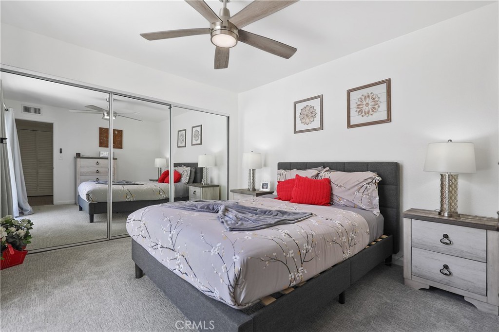 74 Avenida Las Palmas Rancho Mirage, CA 92270 - Photo 16 of 23 a bedroom with a bed and a couch