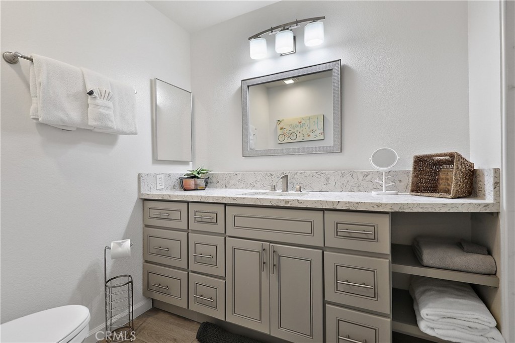 74 Avenida Las Palmas Rancho Mirage, CA 92270 - Photo 17 of 23 a bathroom with a toilet sink and mirror