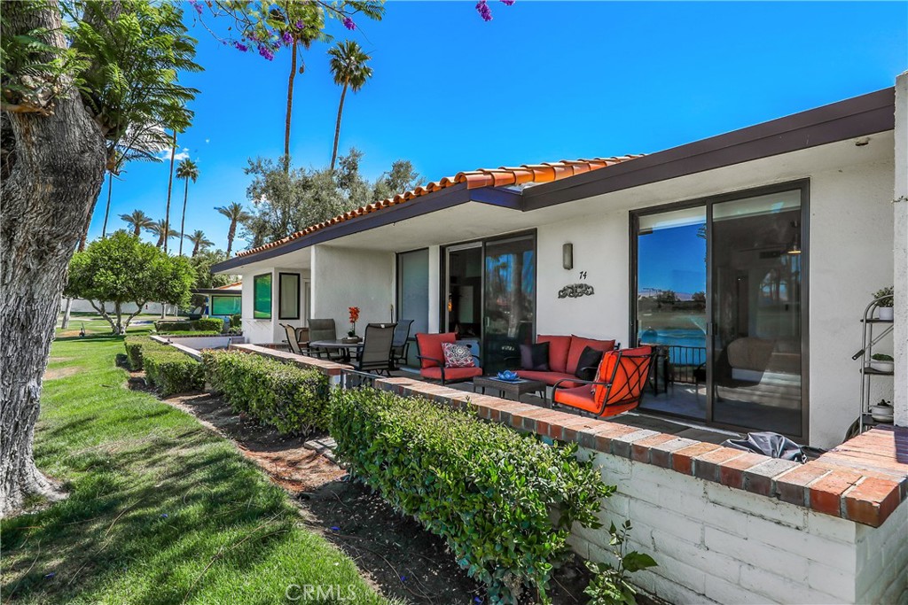74 Avenida Las Palmas Rancho Mirage, CA 92270 - Photo 20 of 23 a view of a house with backyard sitting area and garden