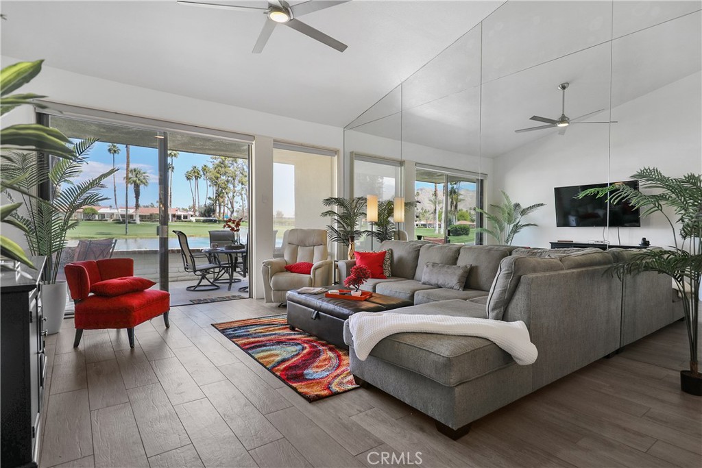 74 Avenida Las Palmas Rancho Mirage, CA 92270 - Photo 2 of 23 a living room with furniture and a flat screen tv