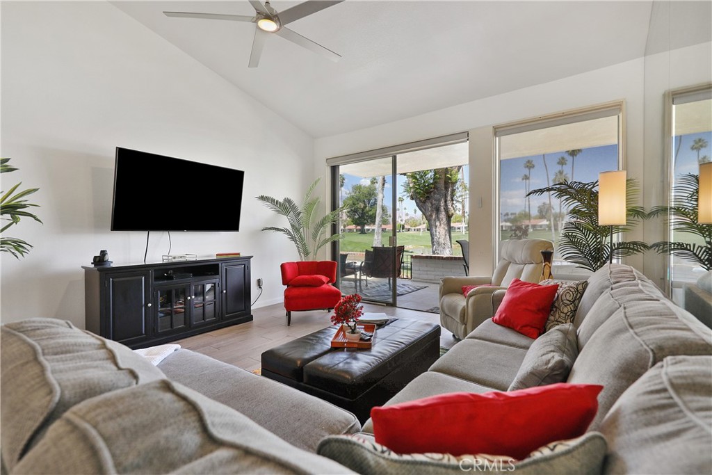74 Avenida Las Palmas Rancho Mirage, CA 92270 - Photo 3 of 23 a living room with furniture and a flat screen tv