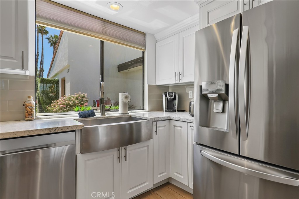 74 Avenida Las Palmas Rancho Mirage, CA 92270 - Photo 9 of 23 a kitchen with stainless steel appliances a refrigerator and a sink