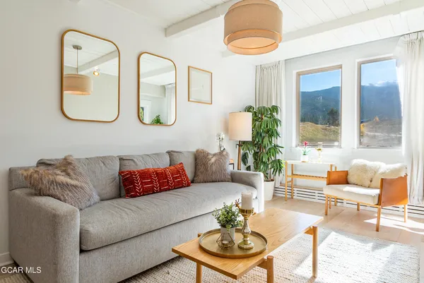 a living room with furniture and a large window