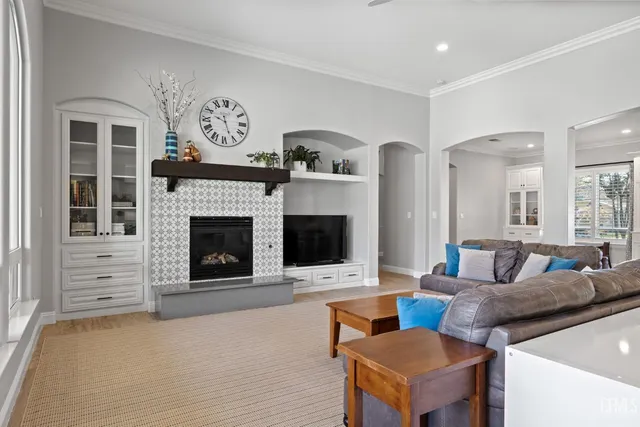 a kitchen with granite countertop white cabinets and stainless steel appliances