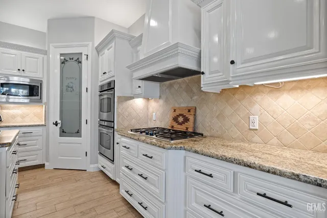 a view of a dining room with furniture and a window