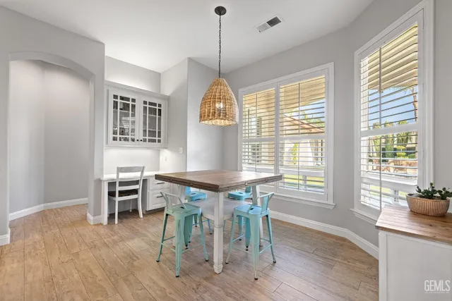 a spacious bathroom with a double vanity sink a mirror and a bathtub