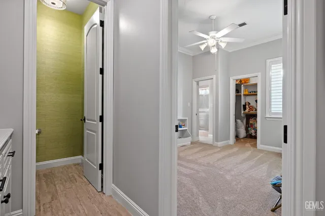 a dining room with furniture a floor to ceiling window and a potted plant