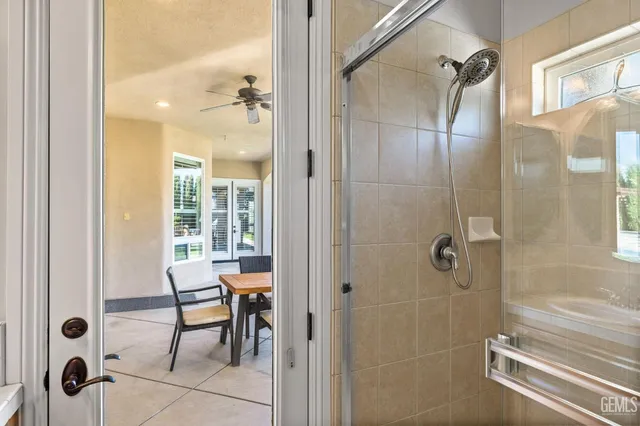 a view of a house with swimming pool and sitting area