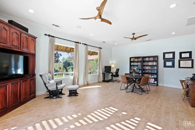 an aerial view of a house with a yard and garden
