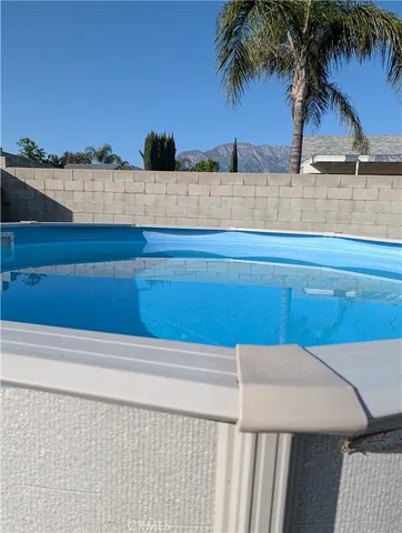 a view of outdoor space with deck and lake view