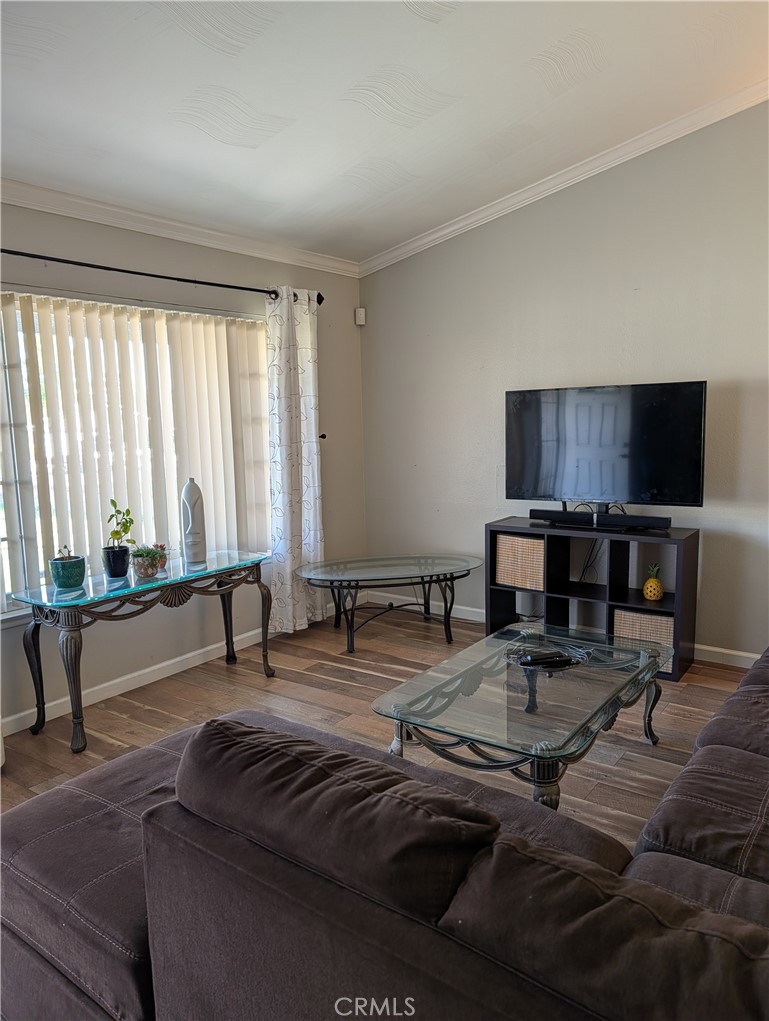 8394 Comet Street Rancho Cucamonga, CA 91730 - Photo 15 of 39 a living room with furniture and a flat screen tv