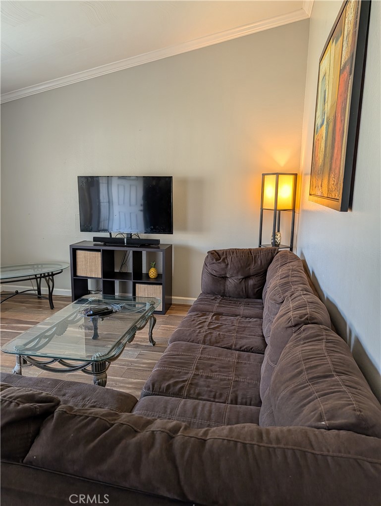 8394 Comet Street Rancho Cucamonga, CA 91730 - Photo 22 of 39 a living room with furniture and a flat screen tv
