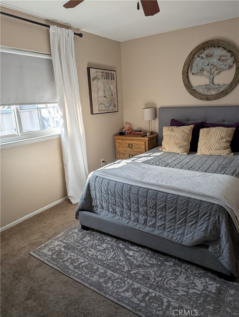 8394 Comet Street Rancho Cucamonga, CA 91730 - Photo 23 of 39 a bedroom with a bed and painting on the wall