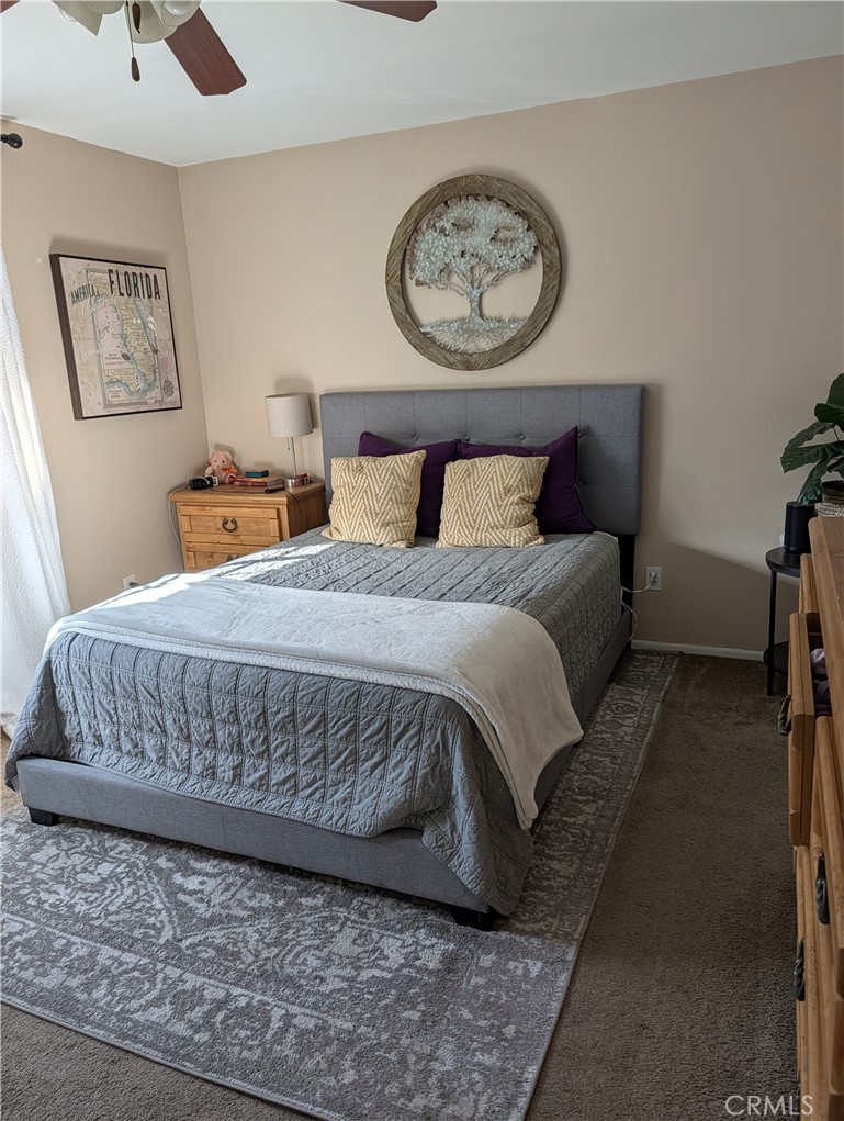 8394 Comet Street Rancho Cucamonga, CA 91730 - Photo 24 of 39 a bedroom with a bed and painting on the wall