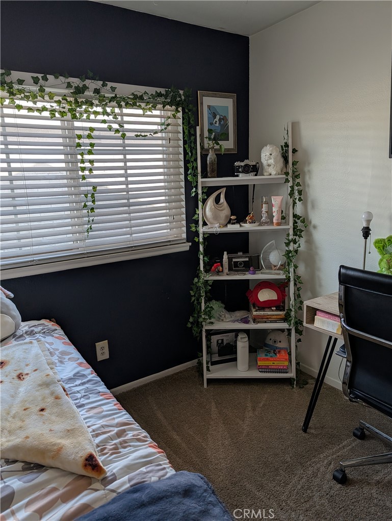 8394 Comet Street Rancho Cucamonga, CA 91730 - Photo 32 of 39 a bedroom with a bed and a desk
