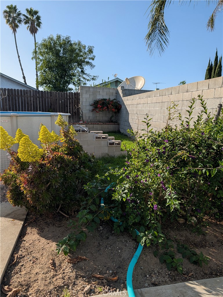 8394 Comet Street Rancho Cucamonga, CA 91730 - Photo 10 of 39 a view of a swimming pool with a patio