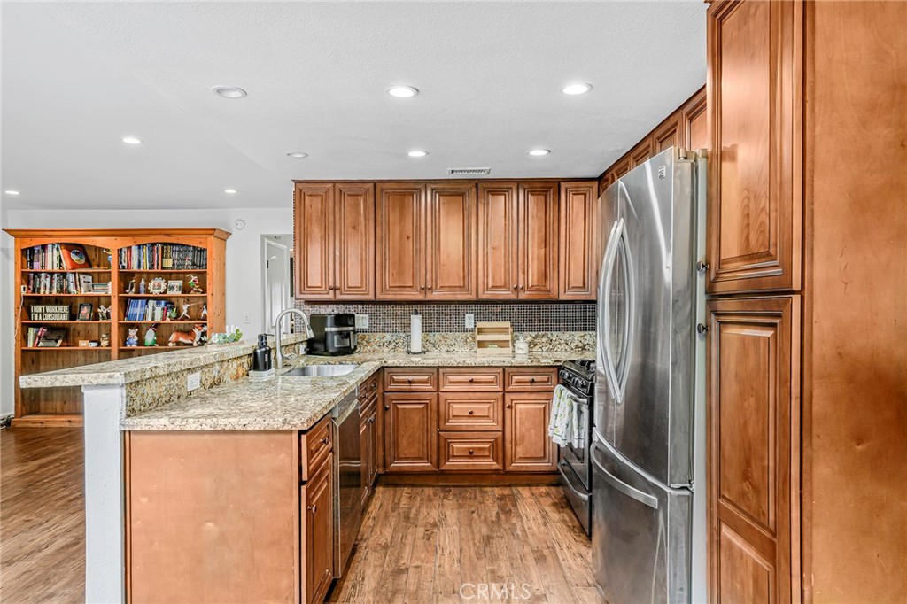 1642 Dalmatia Drive San Pedro, CA 90732 - Photo 11 of 26 a kitchen with a refrigerator sink and cabinets