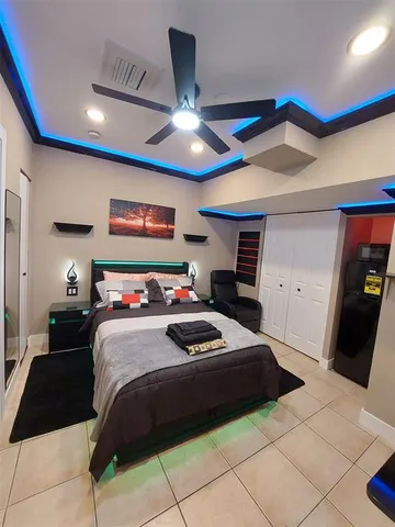 a bedroom with a bed and a walk in closet